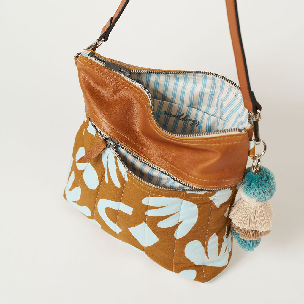 crossbody bag with a blue and tan geometric print