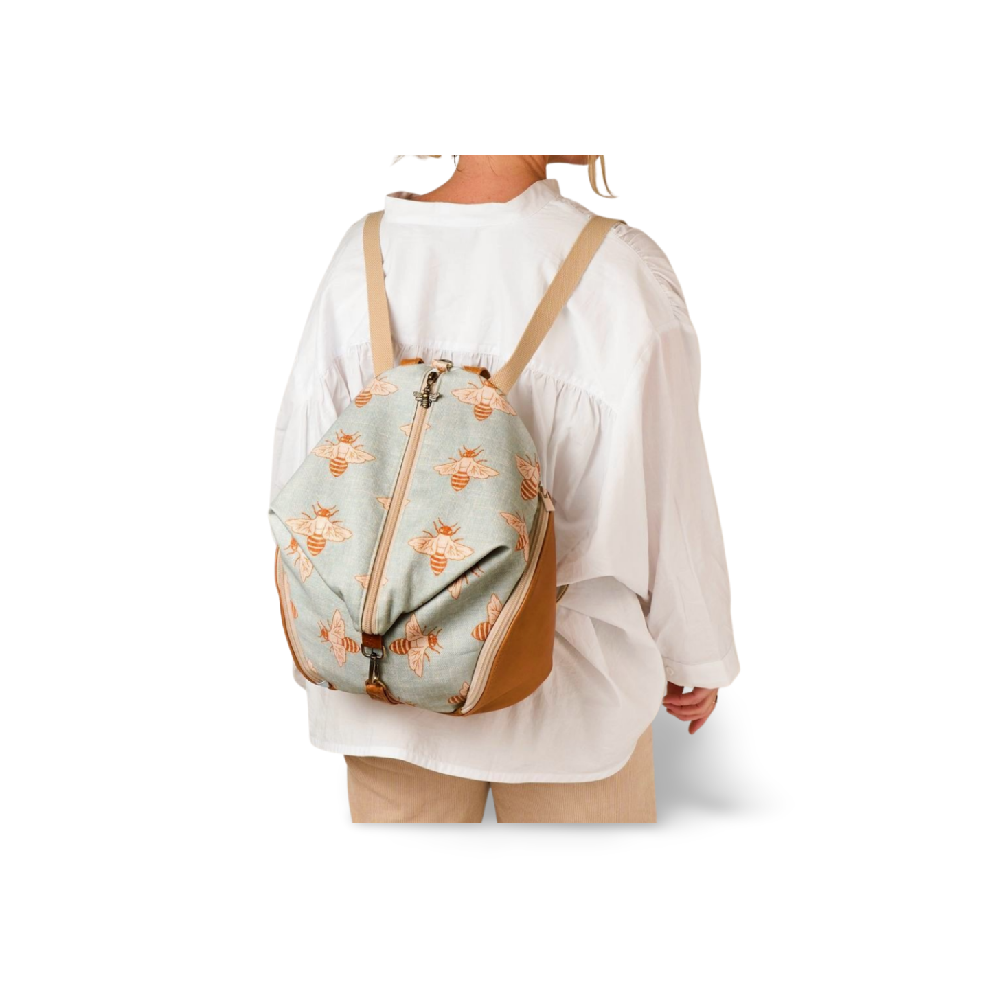 backpack modelled in bee printed canvas with leather trim