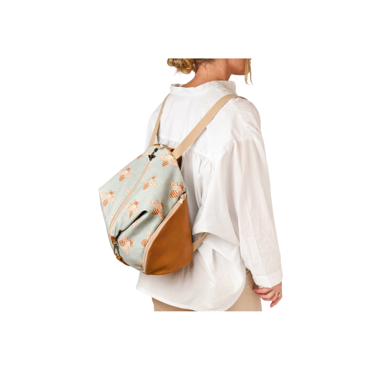 girl wearing backpack in bee printed canvas with leather trim