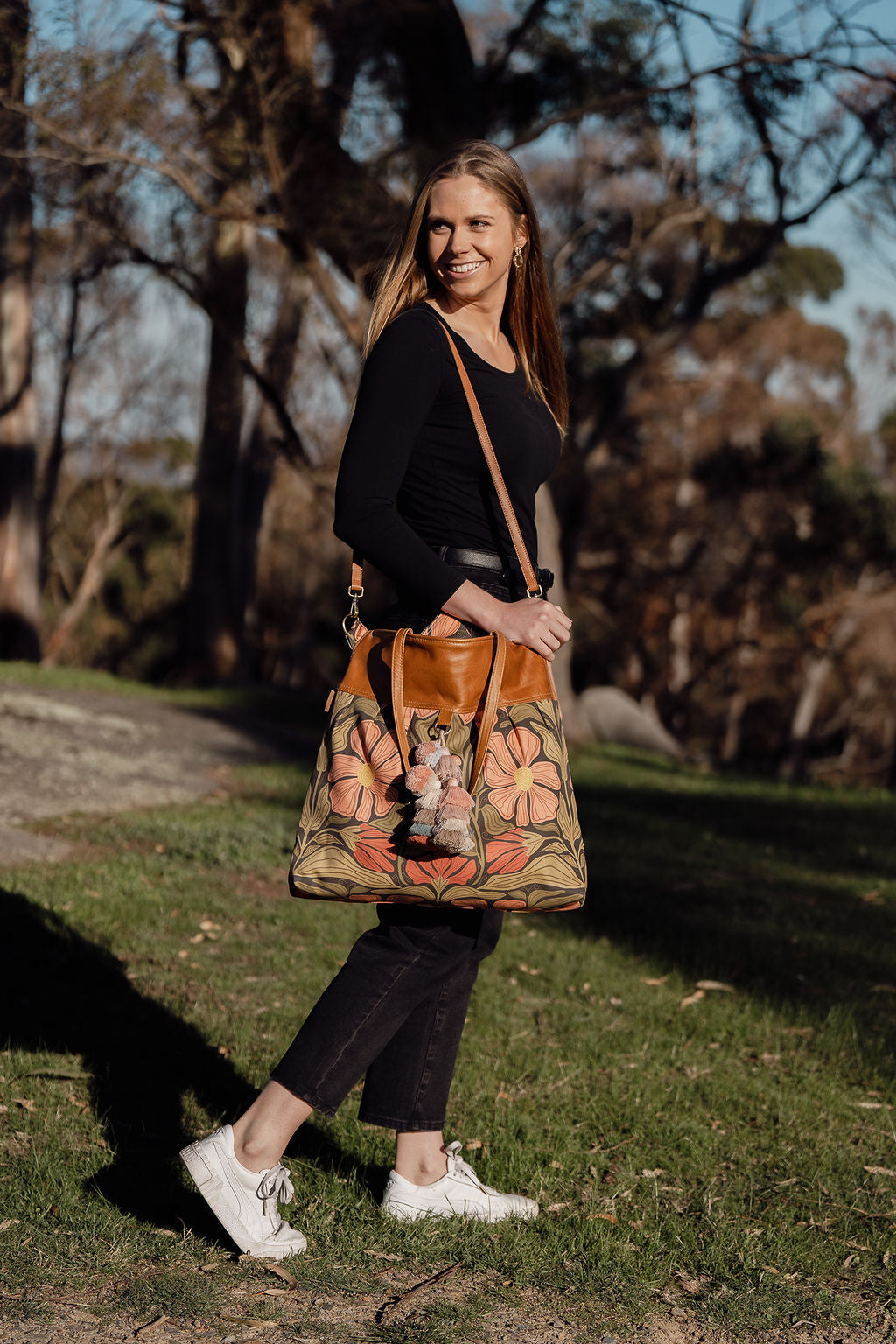 girl holding the large weekender overnight bag