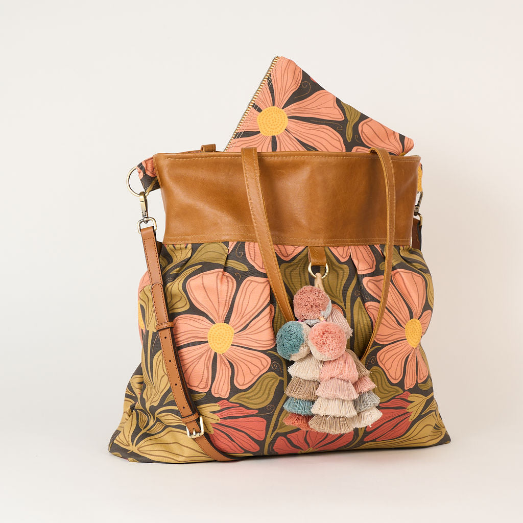 large overnight floral bag and a clutch to match