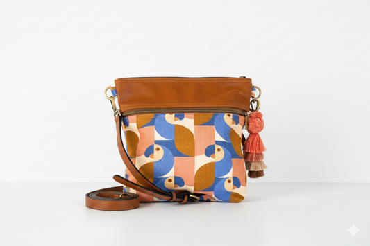 A canas parrot printed bucket bag teamed with leather