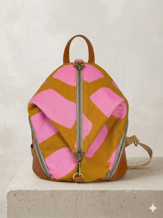 Backpack with pink and brown abstract pattern on a light background