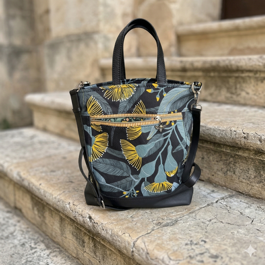 Floral-patterned handbag on stone steps