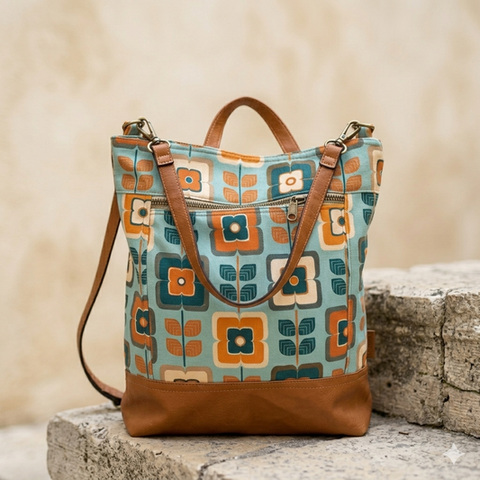 Patterned tote bag with brown accents on a stone surface